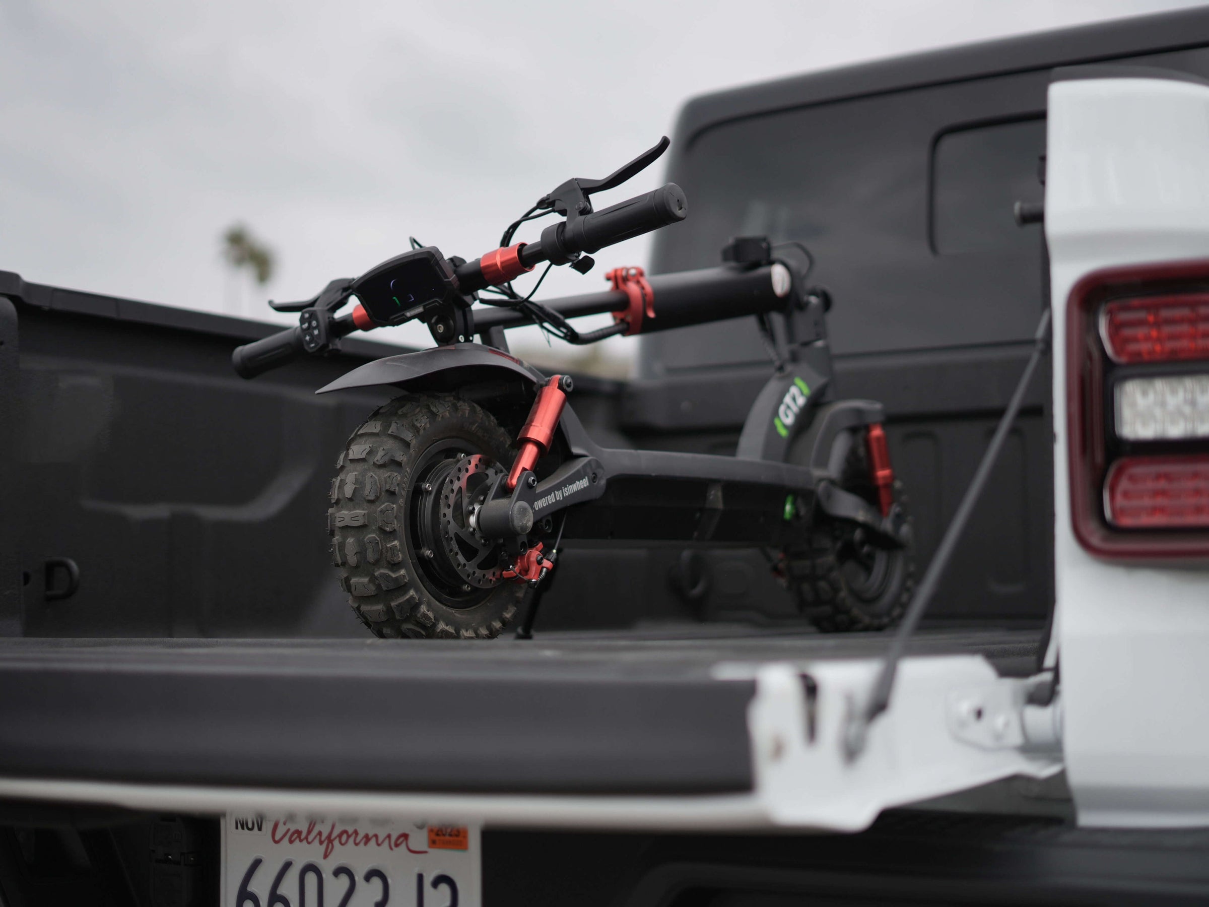 iSinwheel GT2 loaded folded into the bed of a pickup truck
